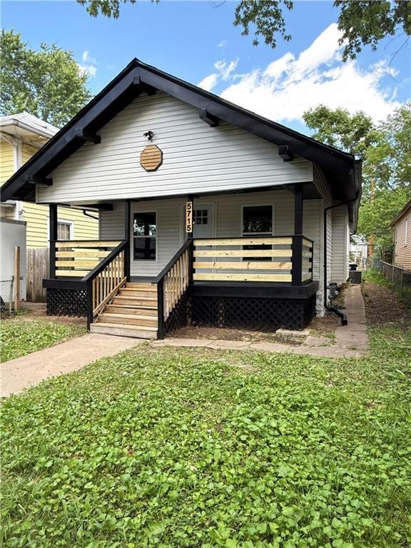 5715 Forest Ave, Kansas City, MO 64110 - back of house with a porch