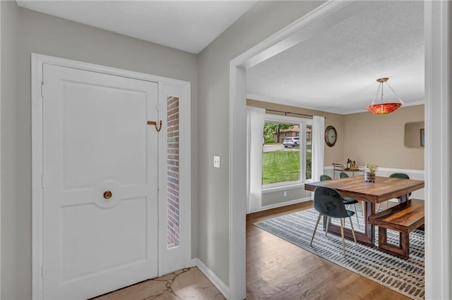 4212 NW Briarcliff Ln, Kansas City, MO 64116 - foyer featuring baseboards and light wood-style flooring