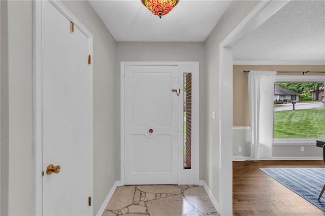 4212 NW Briarcliff Ln, Kansas City, MO 64116 - foyer entrance featuring baseboards
