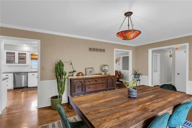 4212 NW Briarcliff Ln, Kansas City, MO 64116 - dining area featuring wood finished floors and ornamental molding