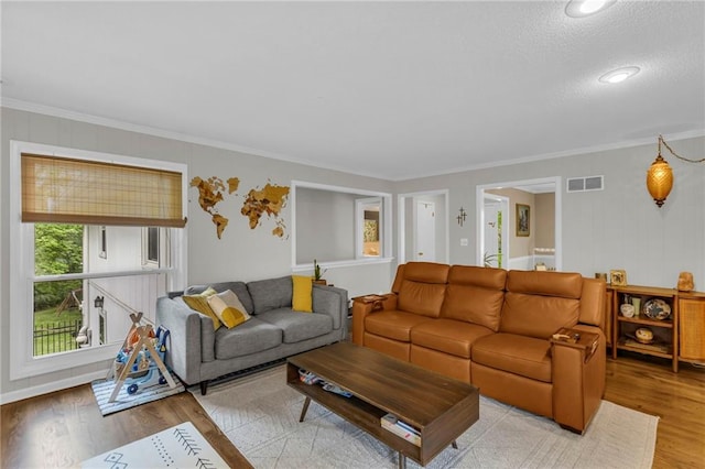 4212 NW Briarcliff Ln, Kansas City, MO 64116 - living room with wood finished floors and ornamental molding