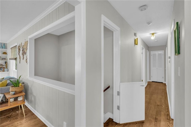 4212 NW Briarcliff Ln, Kansas City, MO 64116 - hallway with wood finished floors, an upstairs landing, and baseboards