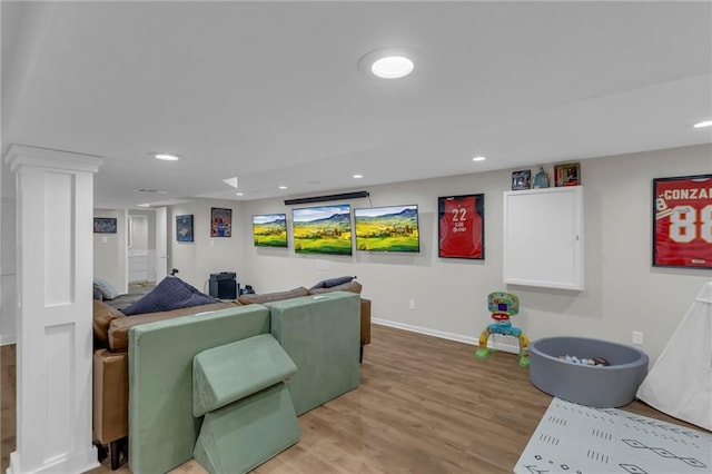 4212 NW Briarcliff Ln, Kansas City, MO 64116 - living area featuring baseboards, light wood finished floors, and recessed lighting