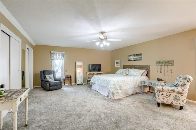 1209 NW Roanoke Dr, Blue Springs, MO 64015 - carpeted bedroom with ceiling fan and two closets
