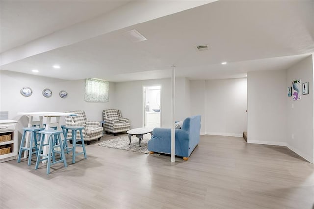 1209 NW Roanoke Dr, Blue Springs, MO 64015 - living area with wood finished floors and recessed lighting
