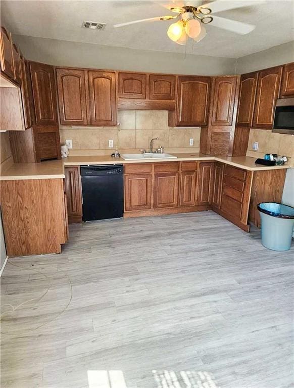 900 E 7th St, Galena, KS 66739 - kitchen featuring dishwasher, a sink, stainless steel microwave, decorative backsplash, and ceiling fan