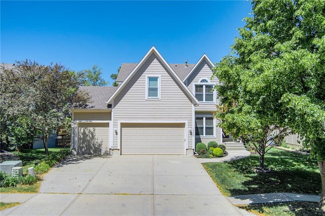 13238 Reeder St, Overland Park, KS 66213 - traditional-style home with concrete driveway and an attached garage