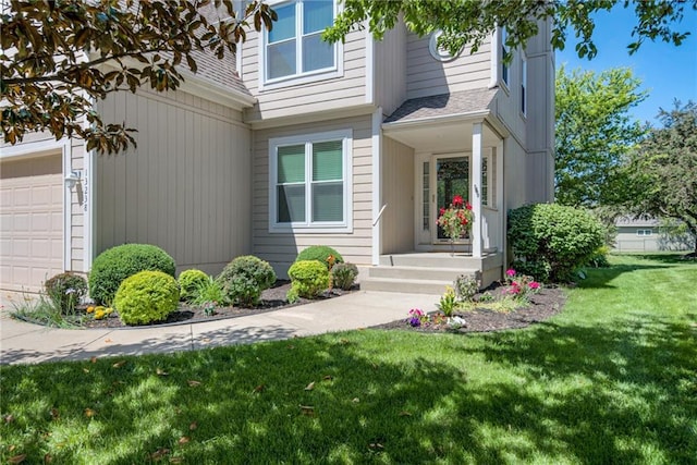 13238 Reeder St, Overland Park, KS 66213 - view of exterior entry featuring a garage, a yard, and roof with shingles