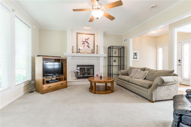 13238 Reeder St, Overland Park, KS 66213 - carpeted living area with a fireplace, ornamental molding, ceiling fan, and baseboards