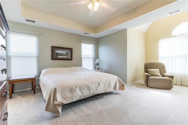 13238 Reeder St, Overland Park, KS 66213 - bedroom featuring light colored carpet, baseboards, a tray ceiling, and a ceiling fan