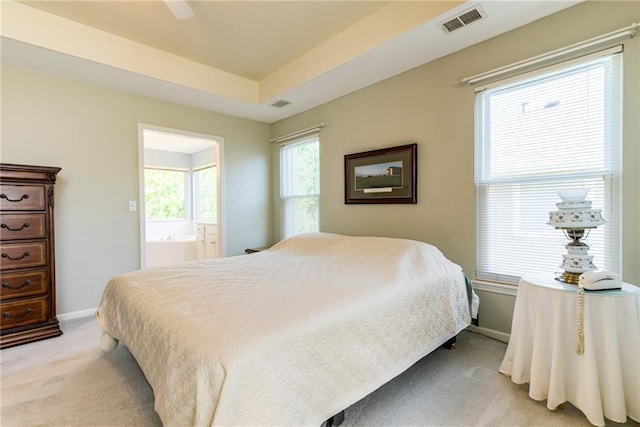 13238 Reeder St, Overland Park, KS 66213 - bedroom with light carpet, connected bathroom, and baseboards