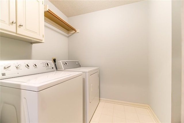 13238 Reeder St, Overland Park, KS 66213 - laundry room featuring washing machine and dryer, cabinet space, and baseboards