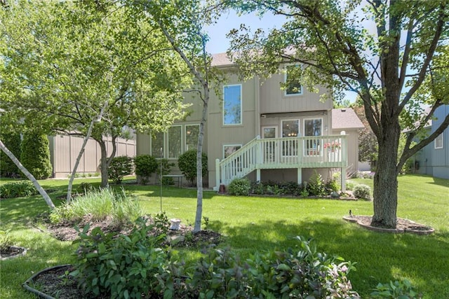 13238 Reeder St, Overland Park, KS 66213 - rear view of property featuring a wooden deck