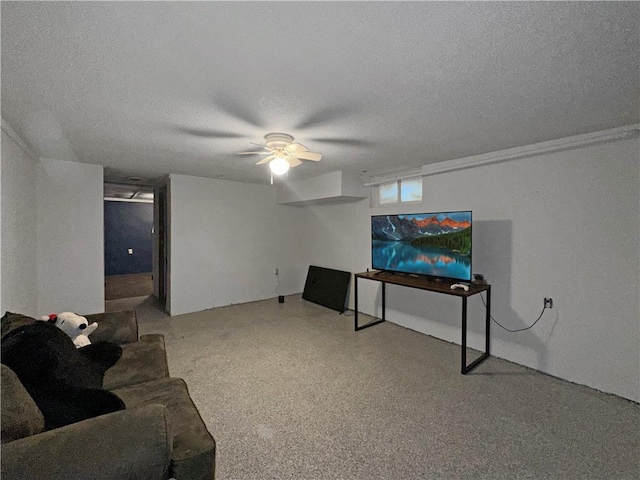 living area with a textured ceiling and a ceiling fan