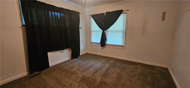 3118 Wallace Ave, Kansas City, MO 64129 - unfurnished room featuring dark colored carpet and baseboards