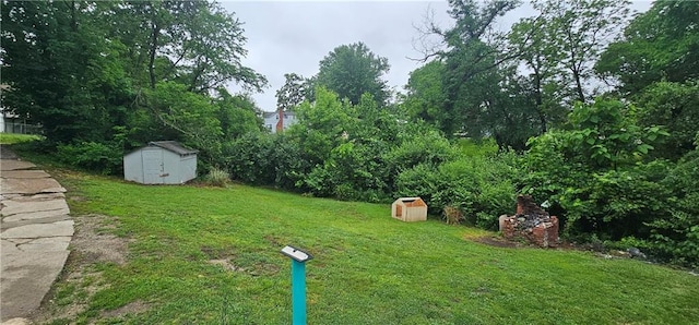 3118 Wallace Ave, Kansas City, MO 64129 - view of grassy yard with a shed
