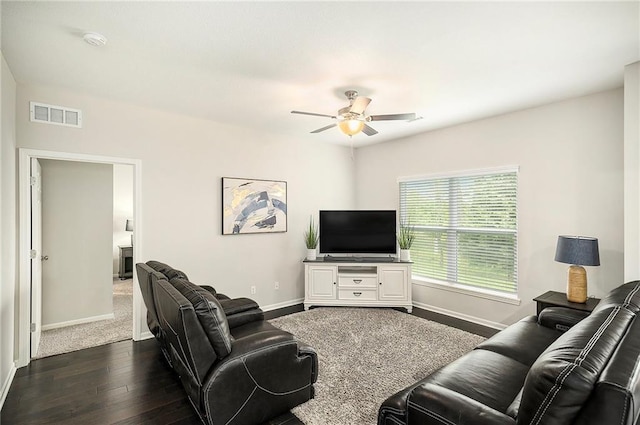 7812 NW 124th St, Kansas City, MO 64163 - living area with ceiling fan, baseboards, and dark wood-style floors