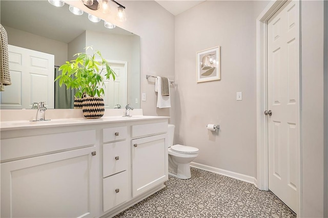 7812 NW 124th St, Kansas City, MO 64163 - full bathroom featuring double vanity, toilet, baseboards, and tile patterned floors