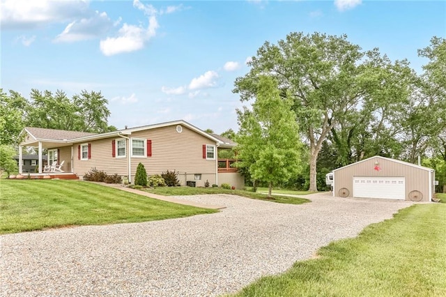 20440 147th St, Basehor, KS 66007 - view of home's exterior with an outbuilding, a garage, a lawn, and a porch