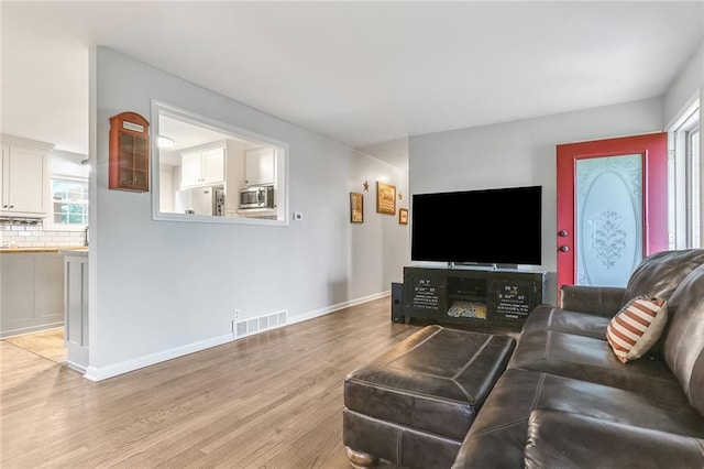 20440 147th St, Basehor, KS 66007 - living room with light wood finished floors and baseboards