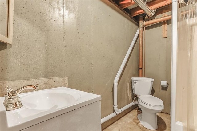 20440 147th St, Basehor, KS 66007 - bathroom with toilet, vanity, and concrete floors