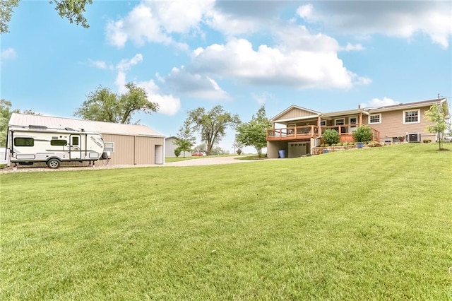 20440 147th St, Basehor, KS 66007 - view of grassy yard with a wooden deck and central air condition unit