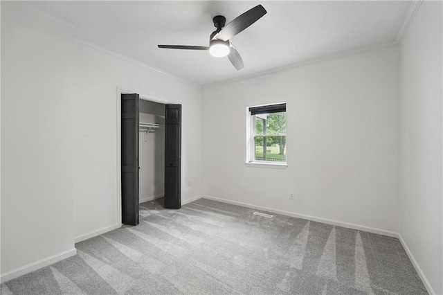 5263 SW Raintree Pkwy, Lees Summit, MO 64082 - unfurnished bedroom with ornamental molding, carpet floors, baseboards, a closet, and a ceiling fan
