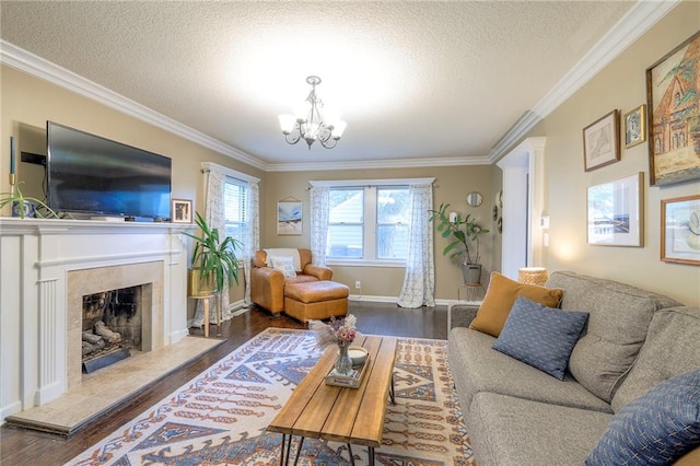 5608 Outlook St, Mission, KS 66202 - living area with crown molding, wood finished floors, a chandelier, a textured ceiling, and a premium fireplace