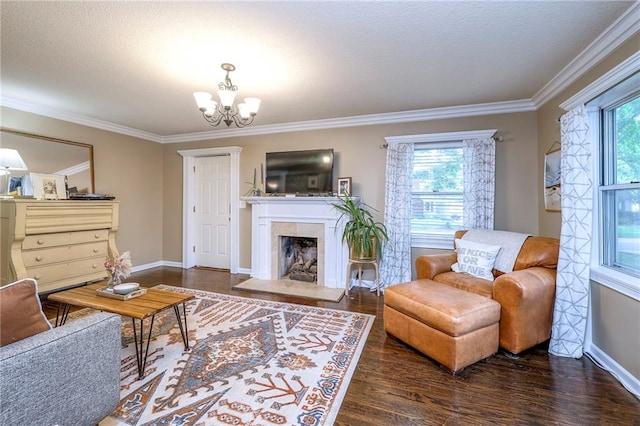 5608 Outlook St, Mission, KS 66202 - living room with wood finished floors, plenty of natural light, a chandelier, ornamental molding, and baseboards
