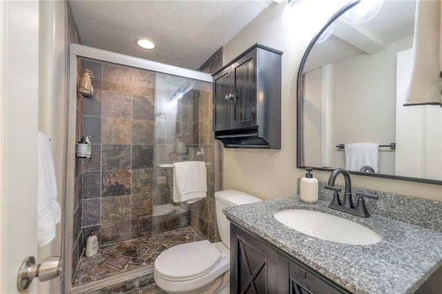 5608 Outlook St, Mission, KS 66202 - bathroom featuring vanity, a textured ceiling, toilet, a shower stall, and recessed lighting