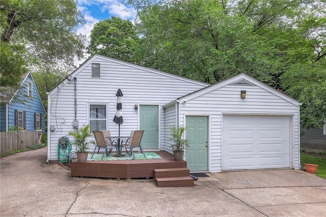 5608 Outlook St, Mission, KS 66202 - view of front of home featuring concrete driveway, a garage, and an outdoor structure