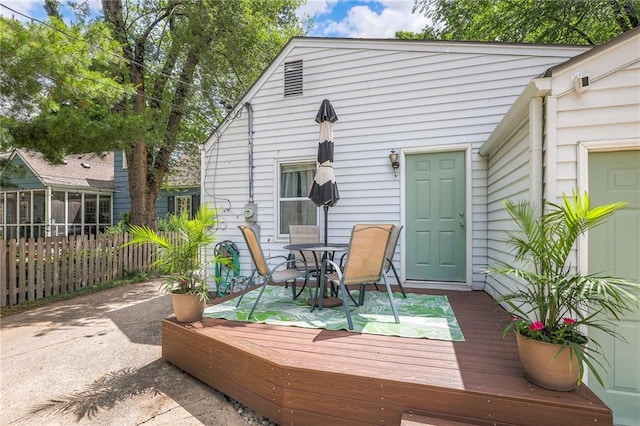 5608 Outlook St, Mission, KS 66202 - wooden deck featuring outdoor dining space