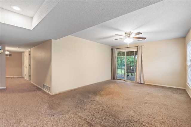 13825 Woodmont Ave, Bonner Springs, KS 66012 - unfurnished room featuring carpet floors, ceiling fan, baseboards, and a textured ceiling
