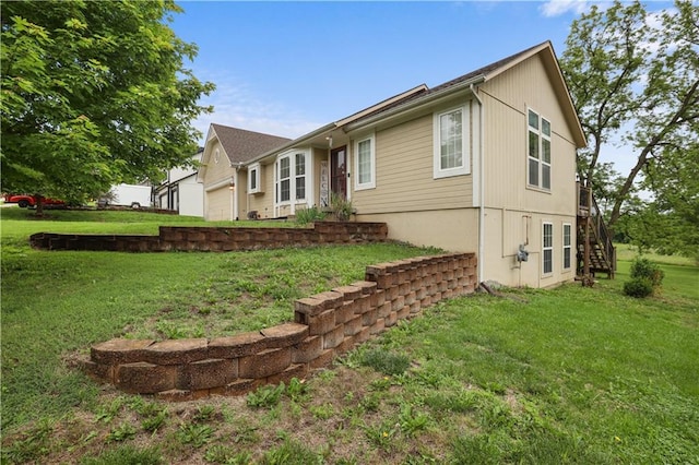 13825 Woodmont Ave, Bonner Springs, KS 66012 - view of home's exterior featuring stairs and a lawn