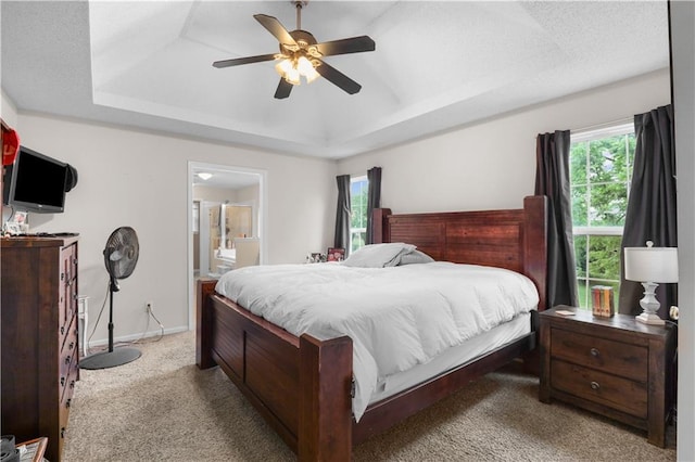 13825 Woodmont Ave, Bonner Springs, KS 66012 - bedroom with a raised ceiling, multiple windows, carpet flooring, and a ceiling fan