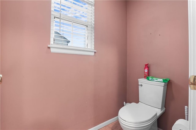13825 Woodmont Ave, Bonner Springs, KS 66012 - bathroom with toilet, baseboards, and tile patterned flooring