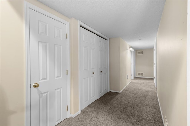 13825 Woodmont Ave, Bonner Springs, KS 66012 - corridor with carpet floors, baseboards, and a textured ceiling