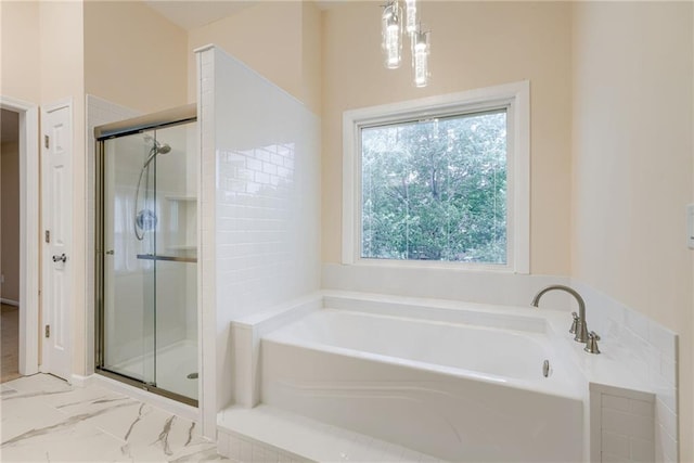 16482 W 132nd Cir, Olathe, KS 66062 - bathroom featuring a garden tub, a shower stall, and marble look tiles