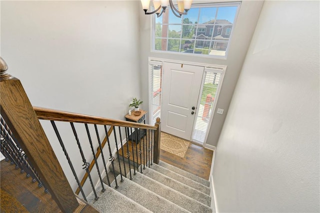 2511 E Maple Ct, Tonganoxie, KS 66086 - foyer featuring a chandelier, baseboards, stairs, healthy amount of natural light, and a towering ceiling