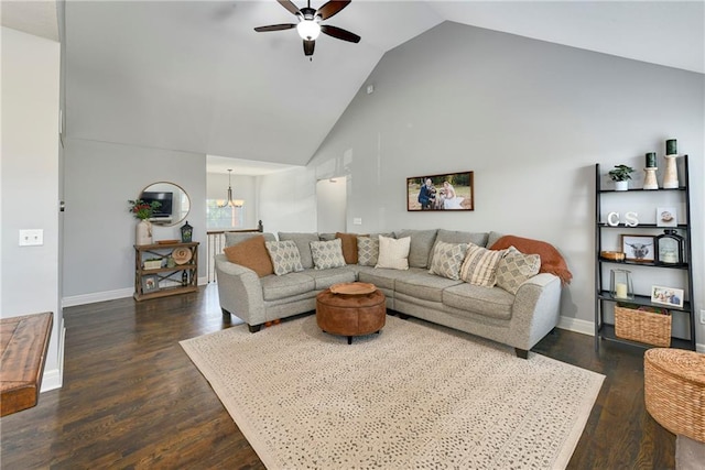2511 E Maple Ct, Tonganoxie, KS 66086 - living room with ceiling fan, a chandelier, dark wood-style floors, high vaulted ceiling, and baseboards