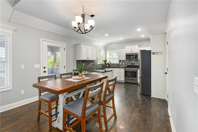 2511 E Maple Ct, Tonganoxie, KS 66086 - dining space featuring baseboards, a chandelier, recessed lighting, and dark wood-type flooring