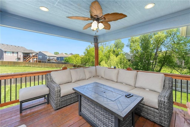 2511 E Maple Ct, Tonganoxie, KS 66086 - wooden deck featuring an outdoor hangout area, a ceiling fan, and a residential view