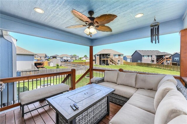 2511 E Maple Ct, Tonganoxie, KS 66086 - wooden terrace featuring a residential view, an outdoor living space, and ceiling fan