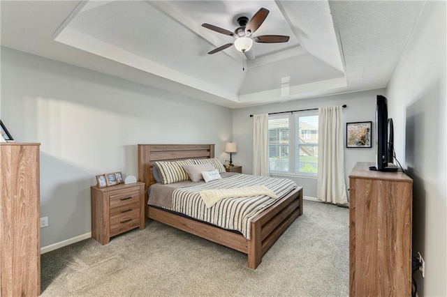 2511 E Maple Ct, Tonganoxie, KS 66086 - bedroom with a raised ceiling, light carpet, and baseboards