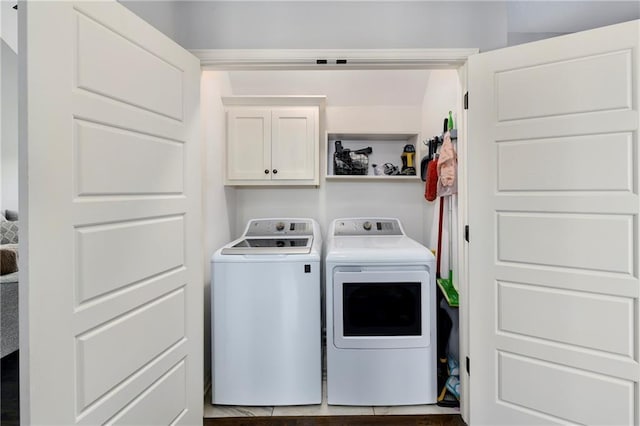 2511 E Maple Ct, Tonganoxie, KS 66086 - laundry room with cabinet space and washing machine and clothes dryer