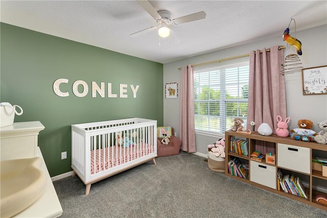 2511 E Maple Ct, Tonganoxie, KS 66086 - carpeted bedroom featuring a nursery area, baseboards, and ceiling fan