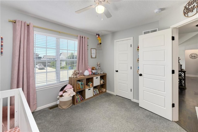 2511 E Maple Ct, Tonganoxie, KS 66086 - carpeted bedroom featuring baseboards, a ceiling fan, and a textured ceiling