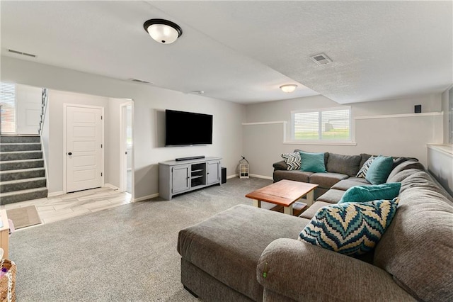 2511 E Maple Ct, Tonganoxie, KS 66086 - living area featuring light carpet, stairway, and baseboards