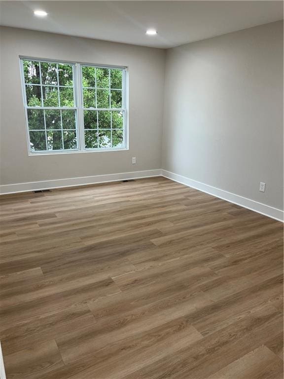 19213 E 15th Terrace Ct N, Independence, MO 64056 - unfurnished room with wood finished floors and recessed lighting