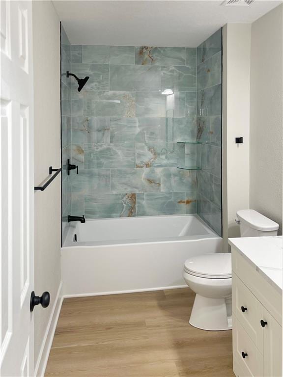 19213 E 15th Terrace Ct N, Independence, MO 64056 - bathroom with vanity, wood finished floors, and shower / bath combination